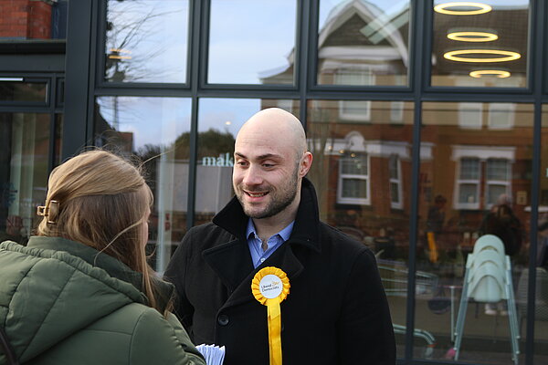 Chris Shank talking to a voter